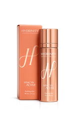 A rose gold cosmetic bottle and its matching rectangular box from Hydrinity Cosmetics, featuring the Hyacyn Active line, on a clean white background.