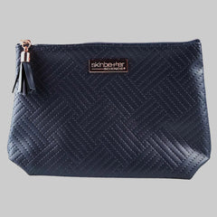 Navy blue quilted pouch with a brand logo on a white background