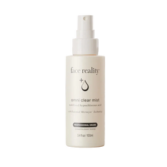 A 3.4 fl oz / 100 ml bottle of face reality Omni Clear Mist on a solid, warm beige background.